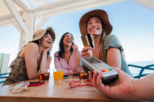 happy-young-group-of-only-women-paying-the-bill-wi-2026-03-24-12-57-47-utc